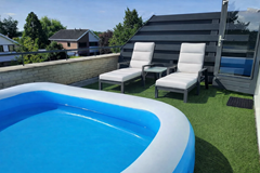 Zonovergoten dakterras met zwembad.png