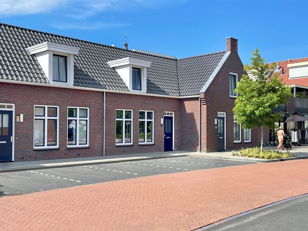 Hoekwoning in het  hart van Scherpenzeel met zonnige tuin! 