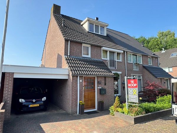 Te koop: Sfeervol en keurig afgewerkte woning met carport, garage,  berging en 4 slaapkamers!
